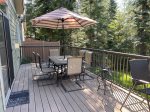 The Deck has a table with umbrella and propane BBQ